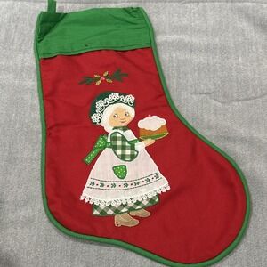 House of Hatten Christmas stocking featuring a Woman Grandma holding a cake